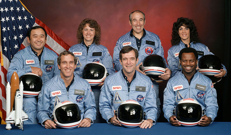 The crew of STS-51-L: (front row) Pilot Michael J. Smith, Shuttle Commander Francis Scobee, Mission Specialist Ronald McNair; (back row) Mission Specialist Ellison Onizuka, Payload Specialist and teacher Christa McAuliffe, Payload Specialist Gregory Jarvis, Mission Specialist Judith Resnik. (NASA)